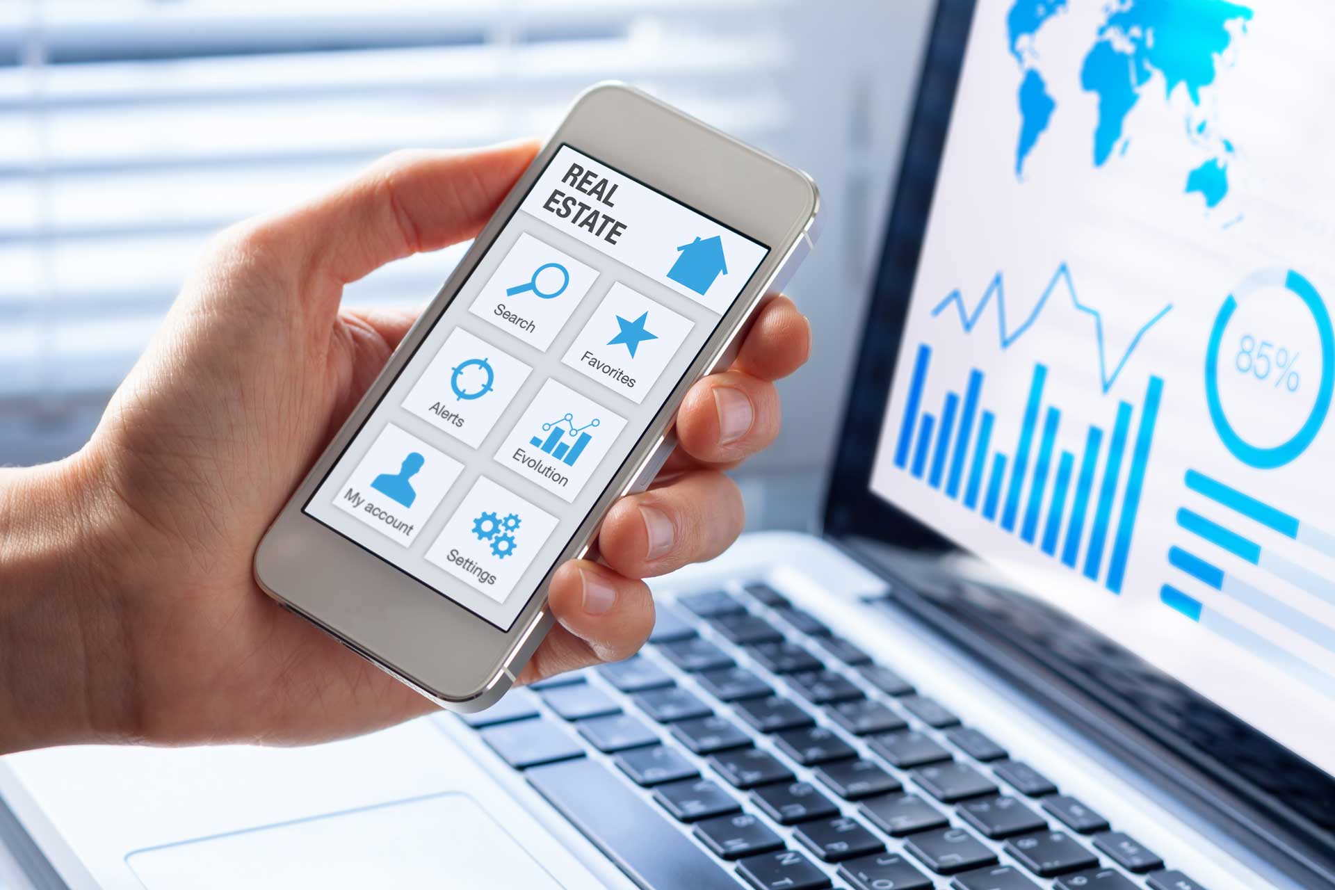 Real estate tools concept on a mobile phone screen, person searching a house, apartment or property to buy or rent online on internet