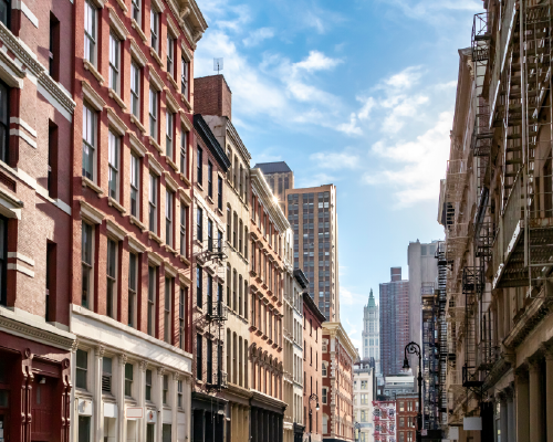 view of a row of older buildings in Manhattan, many f them iconic co-op buildings
