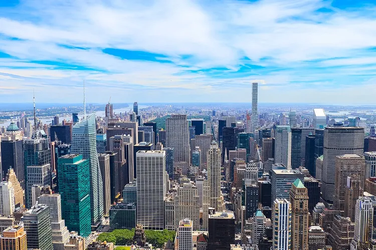 Aerial view of Midtown Manhattan, with Bryant Park in the foreground and Central Park in the back