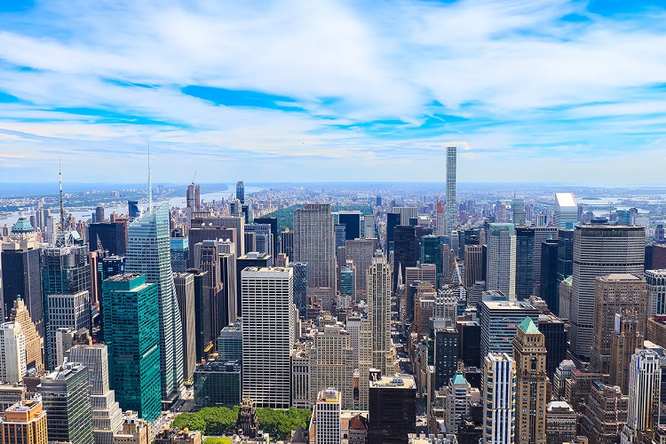 Aerial view of Midtown Manhattan, with Bryant Park in the foreground and Central Park in the back